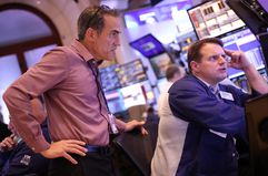 Traders work on the floor of the New York Stock Exchange.