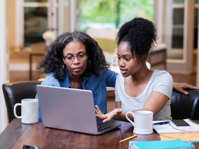 Mother discussing with her child how she's going to pay for her college education