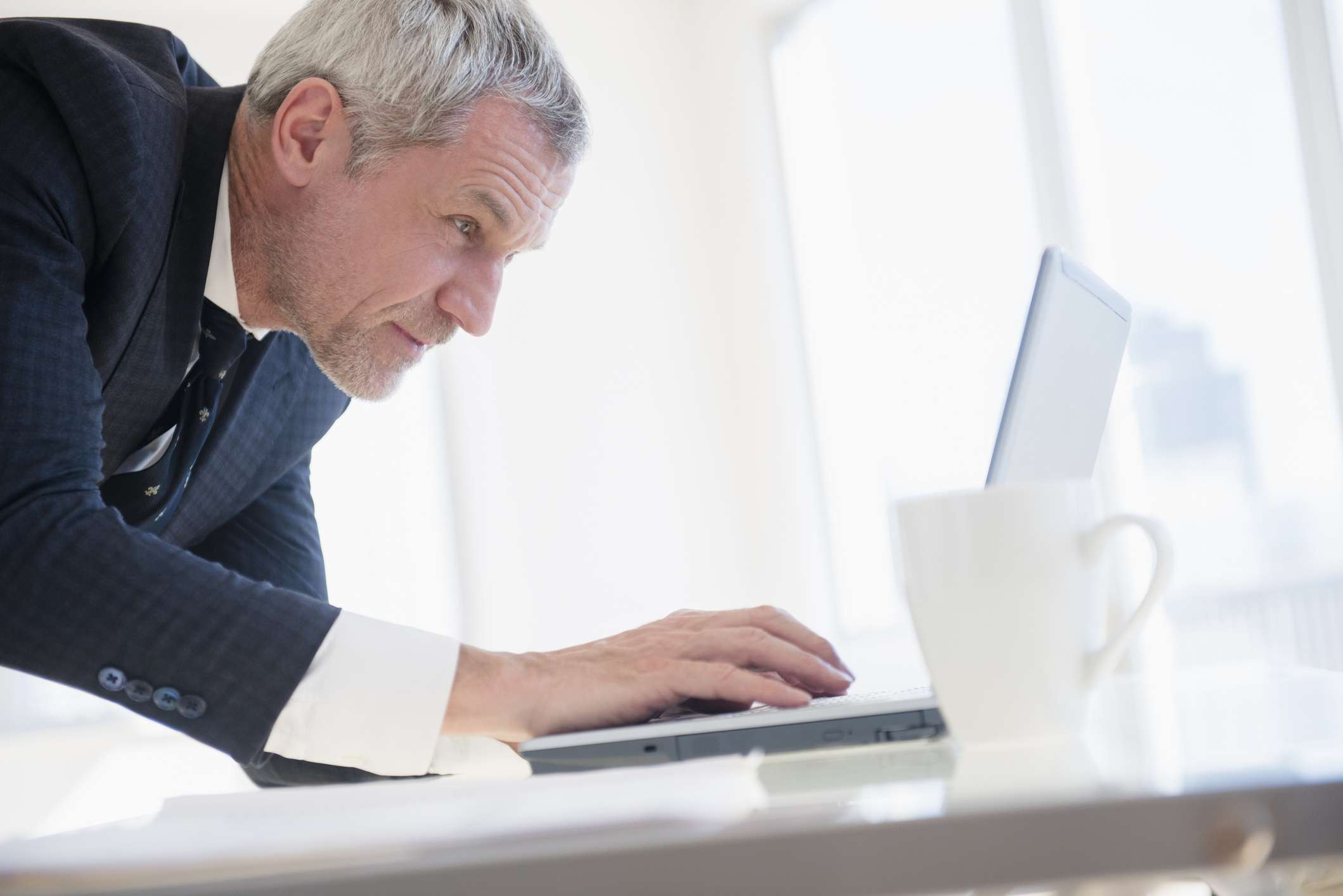 Businessman using laptop.