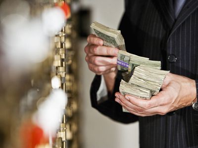 Man With Cash by Safety Deposit Boxes