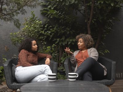 People having coffee together while having discussion about mortgages.