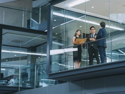 Three business people talking