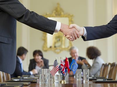 Businessmen Shaking Hands in Meeting