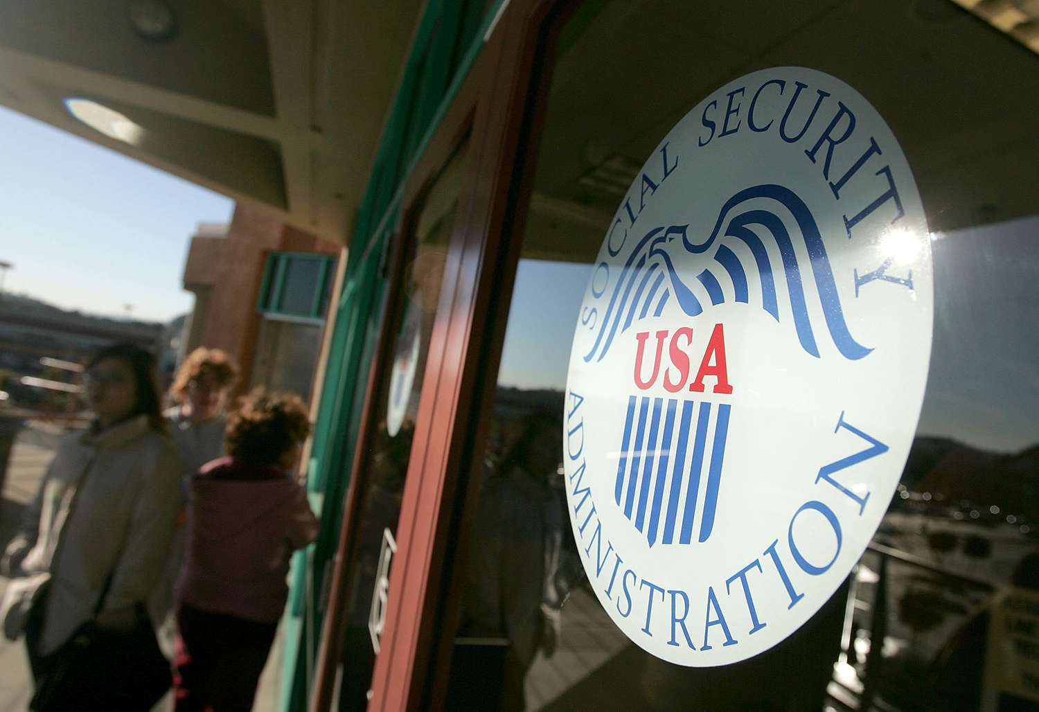 Social Security Administration logo in building window.