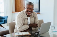 Businessman with a laptop and notebook