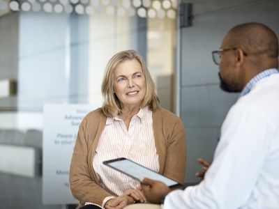 A woman has a discussion with a doctor.