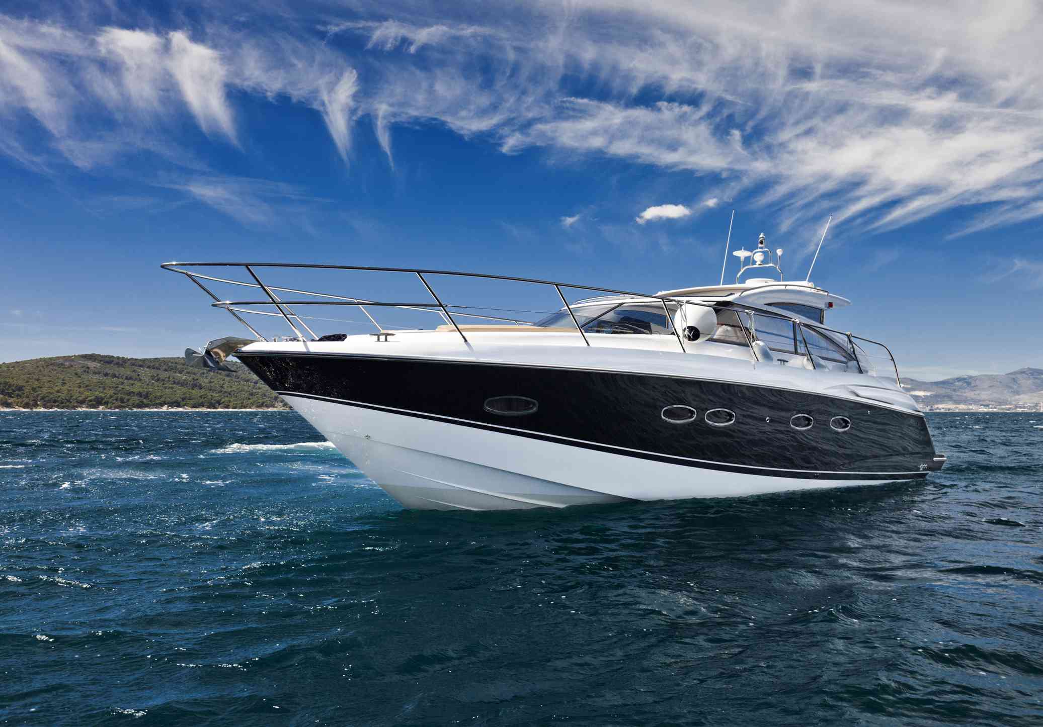 A low angle view of a fast yacht cruising.