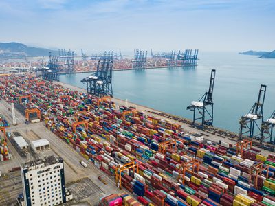 Aerial view of a container port with hundreds of containers