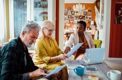 Financial advisor helps retirees review paperwork