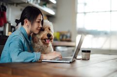 Worker at home with dog