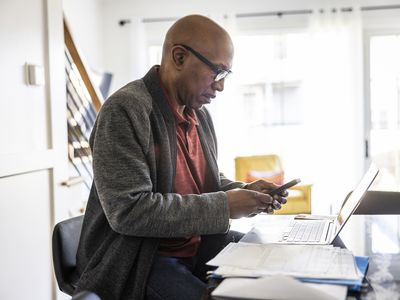 A man uses a smartphone.