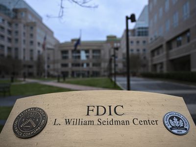 Street view of FDIC building showing building sign in the foreground