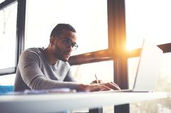 Man Studying at Desk