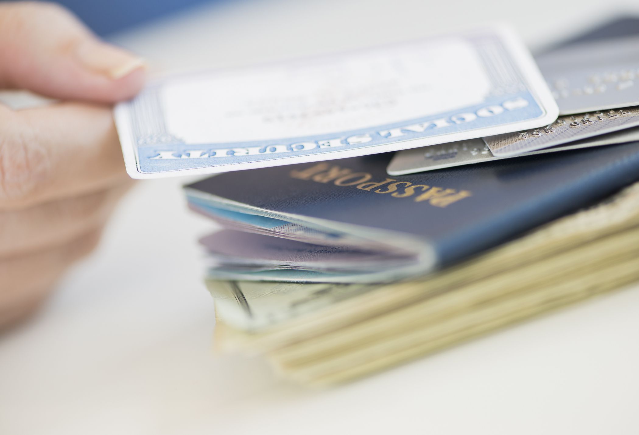 Close-up of woman’s hand holding Social Security card.