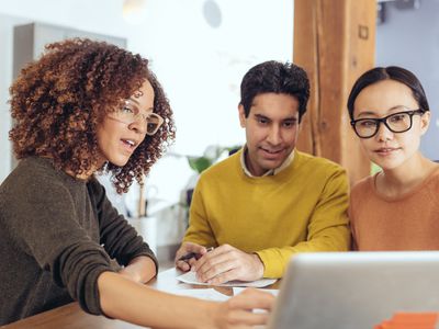 A couple reviews their finances with an advisor.