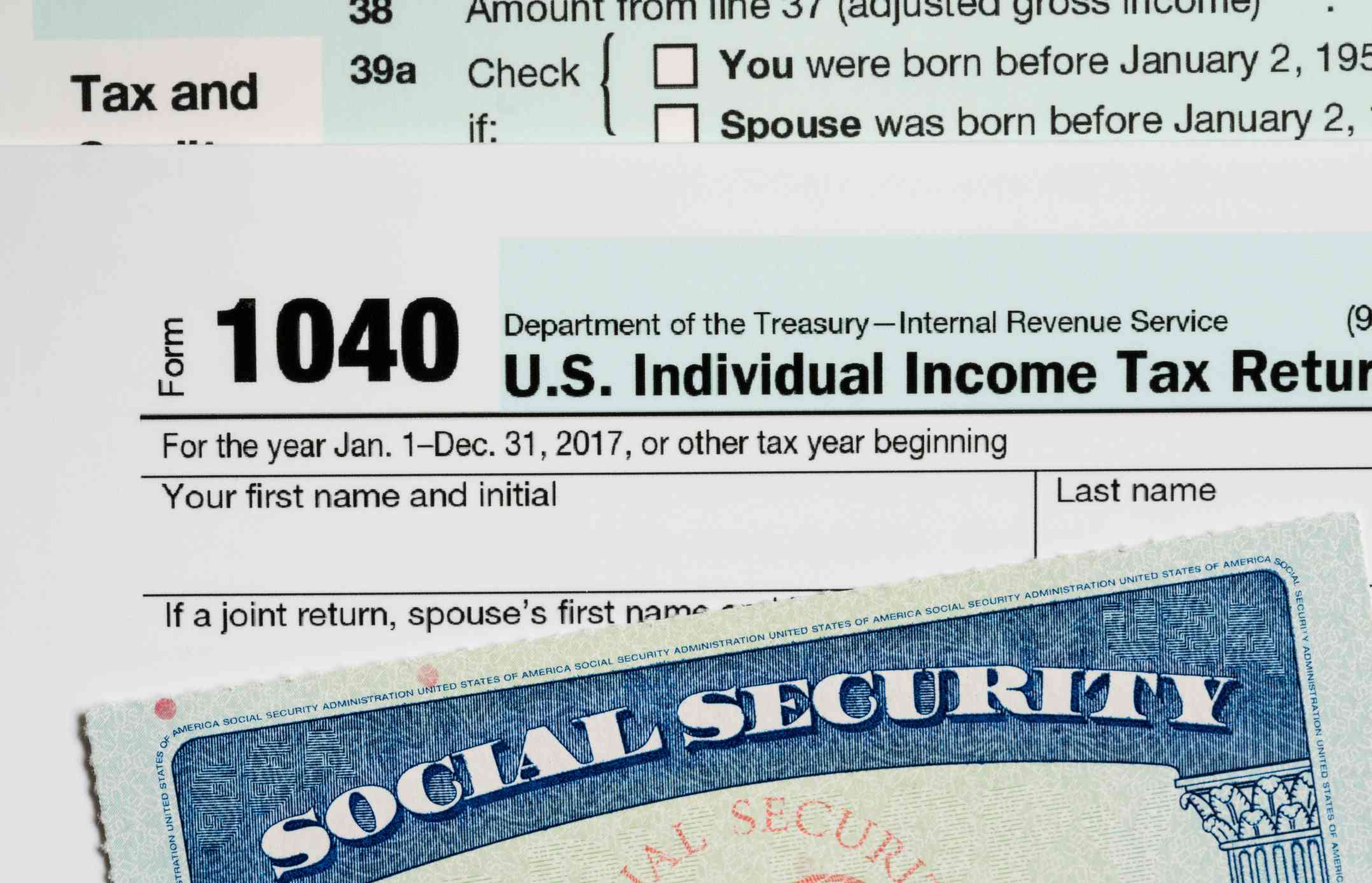 A social security card laid on top of Form 1040 tax return.