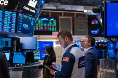 Traders work on the floor of the New York Stock Exchange