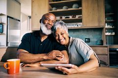 Senior Black couple happy with their retirement plans.