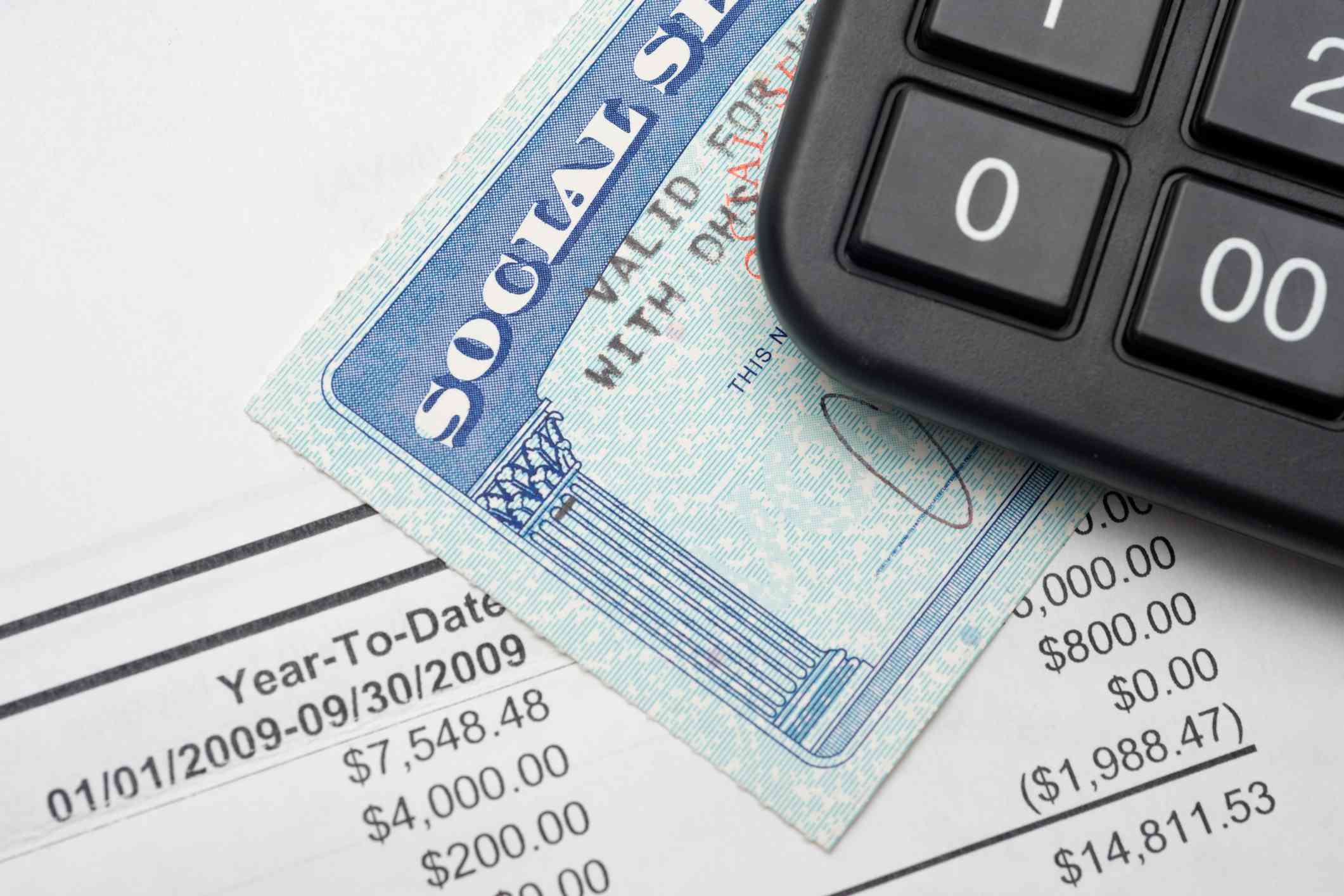 A calculator, Social Security card, and financial statement