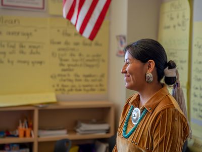 Indigenous Navajo Woman Teacher at the Front of Her Classroom