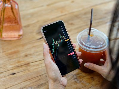 Stock market charts on smartphone screen