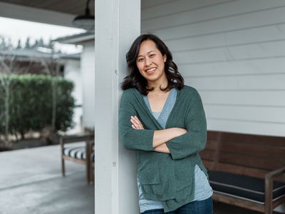 Woman standing on her porch