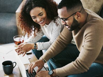 A couple looks over their FHA loan offer.