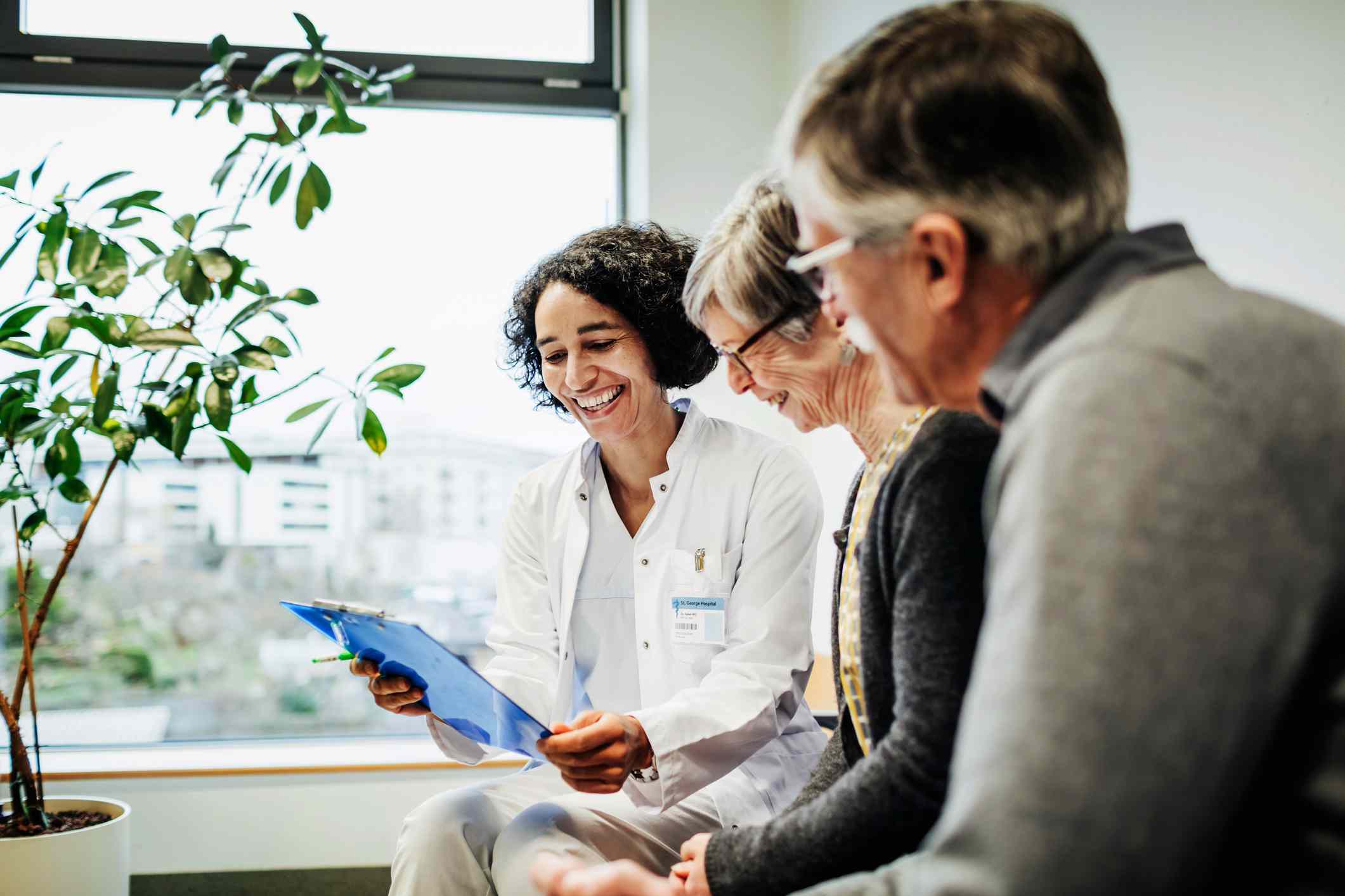 Doctor pleased with elderly couple's test results.