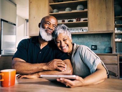 Senior Black couple happy with their retirement plans.