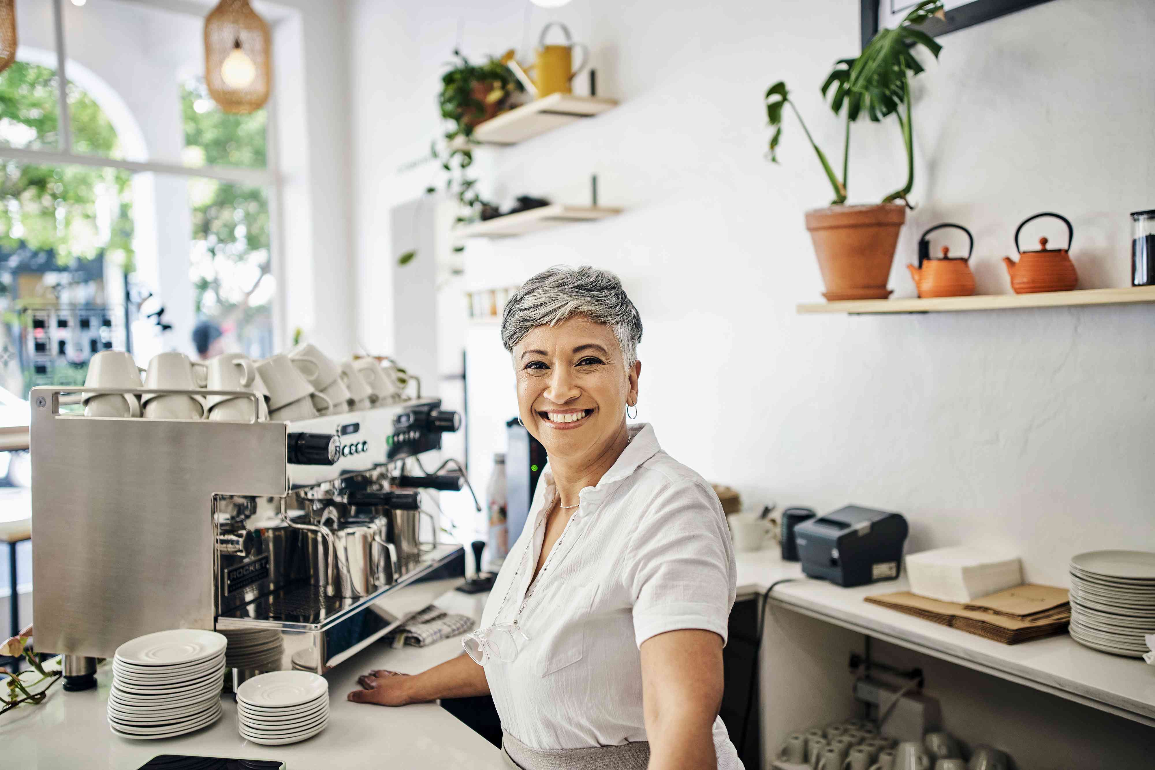 Coffee shop portrait of a woman or small business owner with startup success