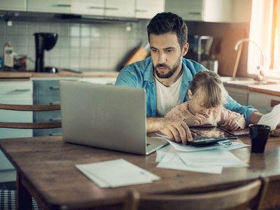 Father and daughter looking at insurance bills