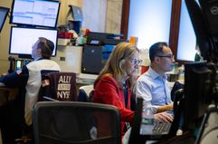 Traders work on the floor of the New York Stock Exchange.