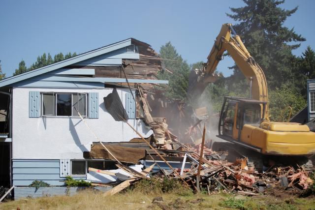 Small Home Being Demolished by Big Machine