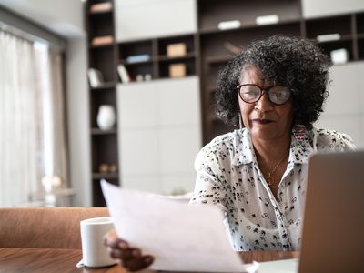 Woman considering the lifetime cost of a major purchase