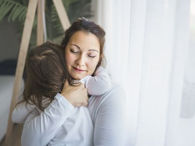 Mother hugging child