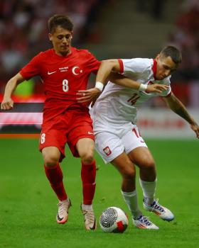 Soccer Football - International Friendly - Poland v Turkey - National Stadium, Warsaw, Poland - June 10, 2024 Poland's Jakub Kiwior in action withTurkey's Arda Guler REUTERS/Kacper Pempel (Kacper Pempel/L'Equipe)