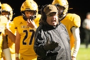 Ogemaw Heights head coach Chad Miller instructs his players during a high school football game at Ogemaw Heights High School on Friday, Nov. 8, 2024. Gladwin won the District Championship over Ogemaw Heights, 28-19. (Kent Miller | For MLive.com)
