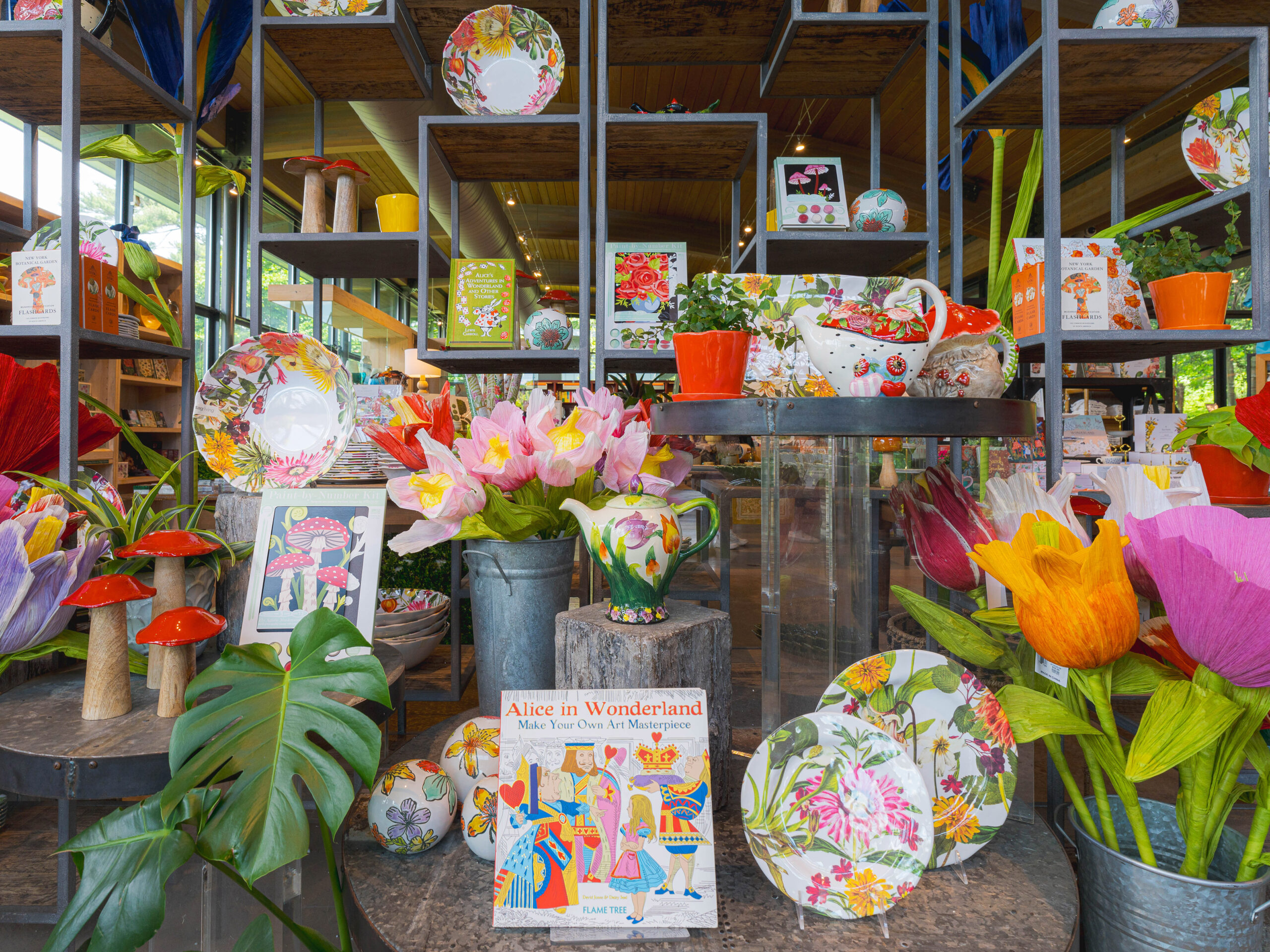 A selection of Alice in Wonderland-themed merchandise arranged in a shop setting