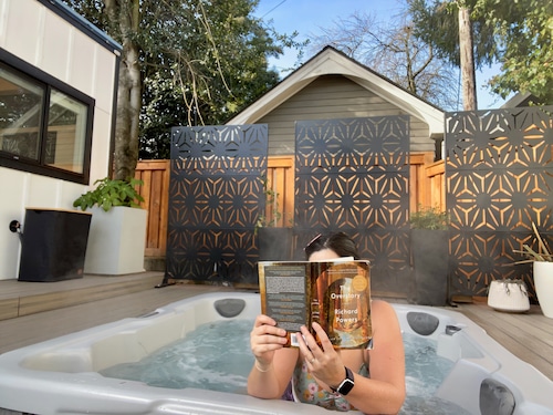 girl in hot tub with book