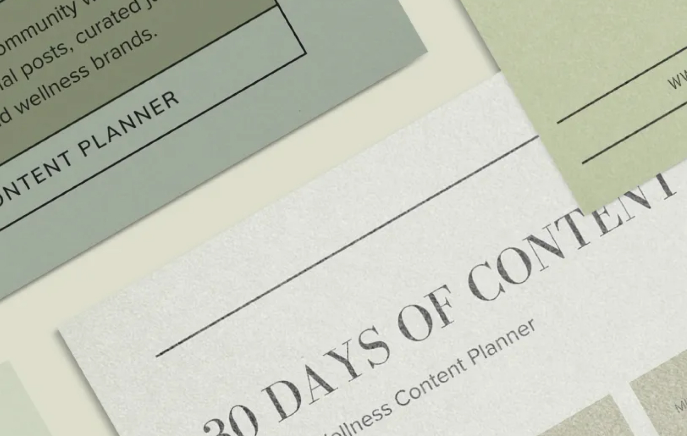 Close-up view of various pastel-colored content planning documents, including a "30 Days of Content" wellness content planner, partially visible text, and design elements, ideal for a social media planner | plannthat.com