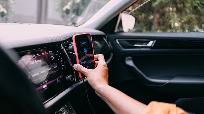 woman using a phone and an app while driving