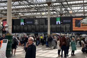 Travellers mill in the main concourse at Edinburgh Waverley, with the electronic billboards showing blank throughout the station. Picture: Steven Chisholm