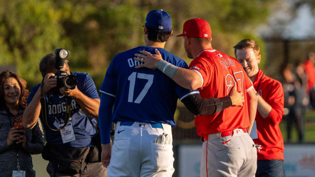 Mar 5, 2024; Phoenix, Arizona, USA; Los Angeles Dodgers two-way player Shohei Ohtani (17) and Los Angeles Angels outfielder Mike Trout (27) pose for a photo before the start of a spring training game at Camelback Ranch-Glendale.