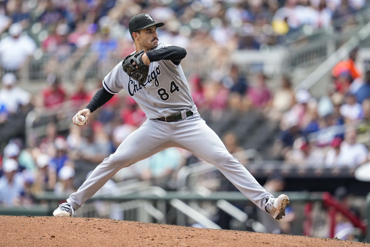 Dylan Cease brings his arm back to throw a pitch