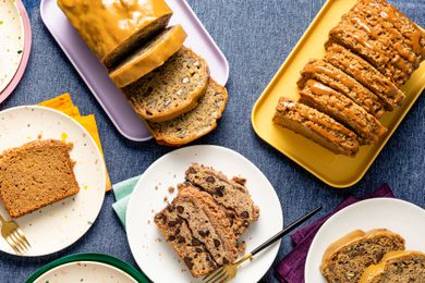 Four types of banana bread on platters and plates