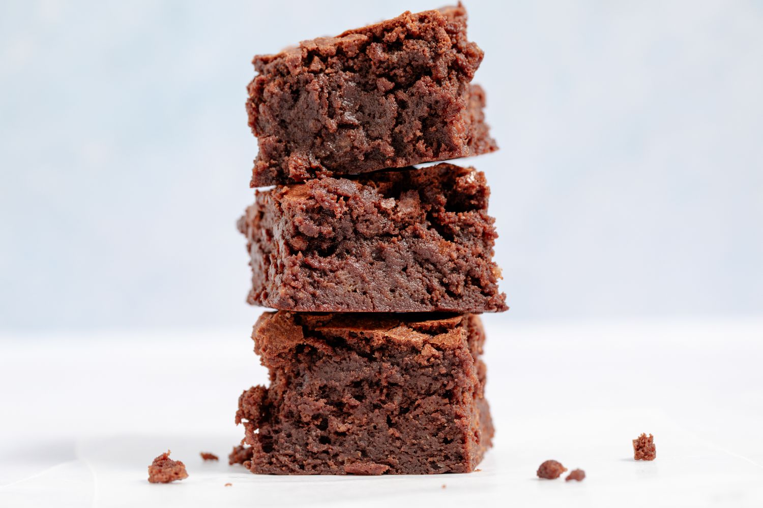 A stack of three fudgy brownies