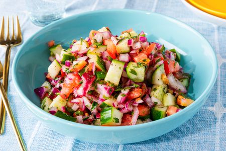 kachumber salad in a blue bowl