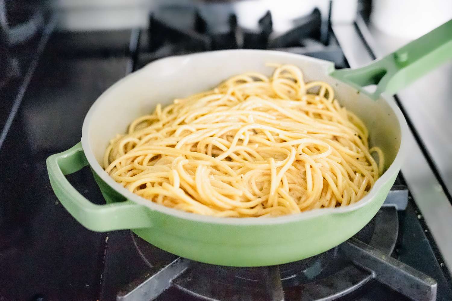 Boiled Bucatini Pasta in a Pan on a Stove for Cacio e Pepe Recipe