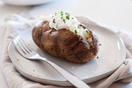 Air Fryer Baked Potatoes Topped with Sour Cream