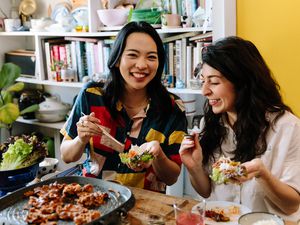 Two woman enjoying Korean BBQ